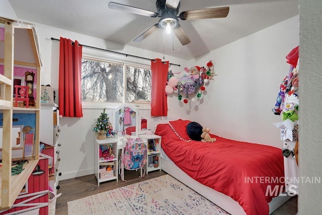 bedroom with hardwood / wood-style flooring and ceiling fan