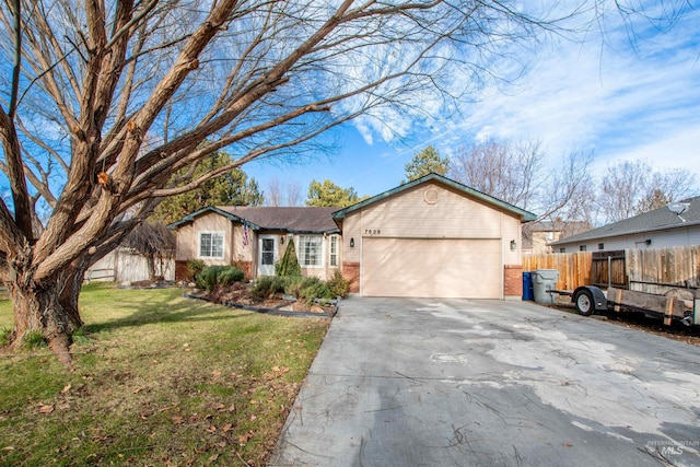 single story home featuring a garage and a front lawn