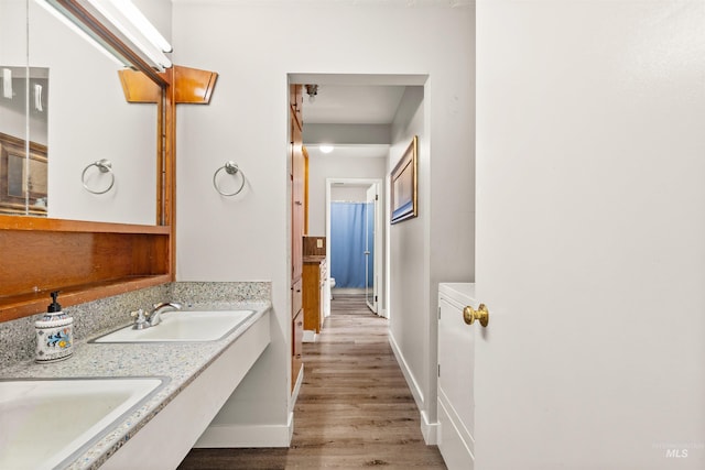 bathroom featuring vanity and hardwood / wood-style flooring