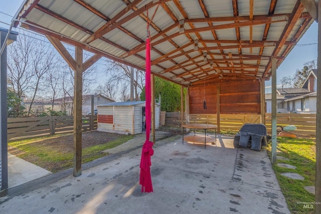 view of patio / terrace with a storage shed