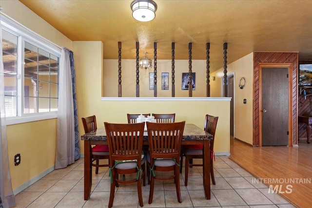 dining room with baseboards and tile patterned floors