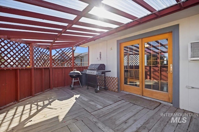 deck featuring a grill and fence