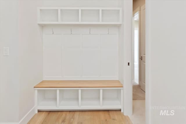 mudroom with wood-type flooring