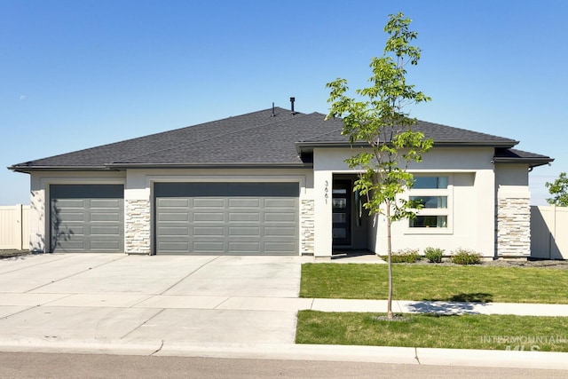 3661 S Corabell Way, Meridian, ID 83642 - prairie-style home featuring an attached garage, stone siding, concrete driveway, and stucco siding