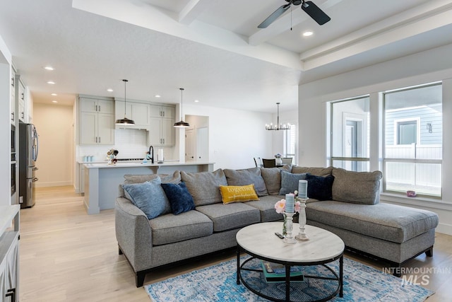 3661 S Corabell Way, Meridian, ID 83642 - living area featuring light wood-style flooring, a ceiling fan, a chandelier, recessed lighting, and beamed ceiling