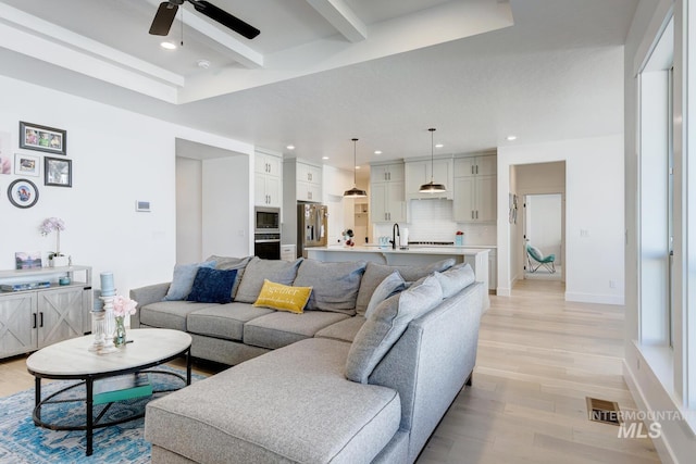 3661 S Corabell Way, Meridian, ID 83642 - living area with ceiling fan, light wood-type flooring, beamed ceiling, recessed lighting, and baseboards