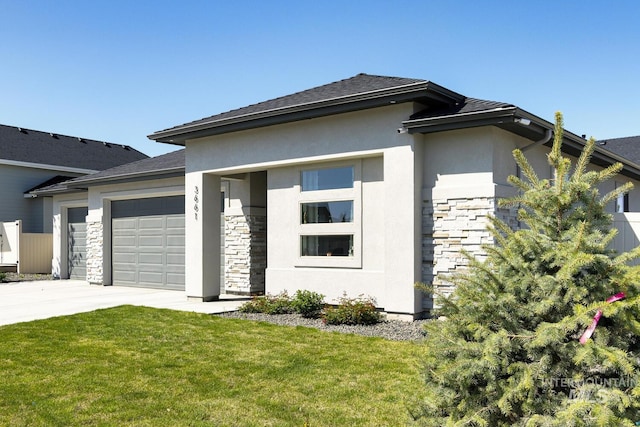 3661 S Corabell Way, Meridian, ID 83642 - prairie-style house with stone siding, a garage, concrete driveway, a front lawn, and stucco siding