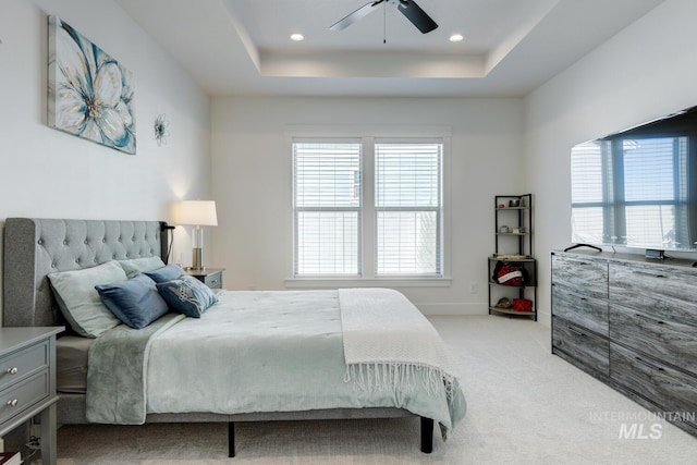 3661 S Corabell Way, Meridian, ID 83642 - bedroom featuring light carpet, a tray ceiling, recessed lighting, ceiling fan, and baseboards