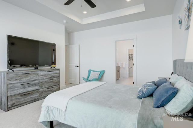 3661 S Corabell Way, Meridian, ID 83642 - bedroom featuring a tray ceiling, recessed lighting, ensuite bath, light colored carpet, and a ceiling fan