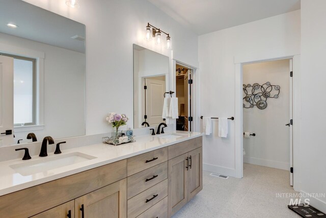 3661 S Corabell Way, Meridian, ID 83642 - full bathroom featuring double vanity, baseboards, toilet, and recessed lighting