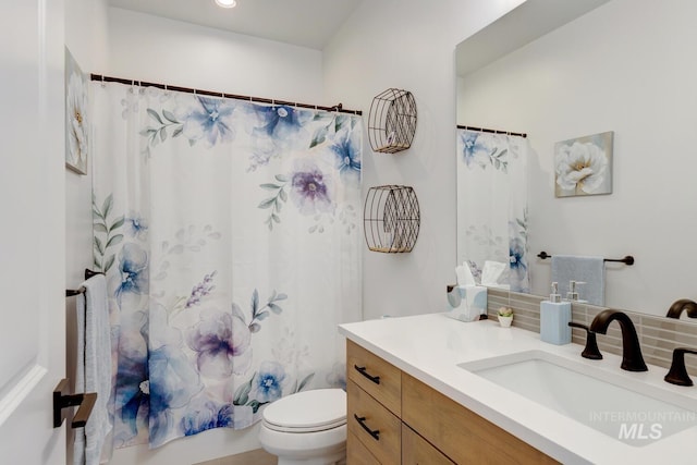 3661 S Corabell Way, Meridian, ID 83642 - bathroom with decorative backsplash, toilet, and vanity