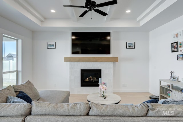 3661 S Corabell Way, Meridian, ID 83642 - living room featuring wood finished floors, a ceiling fan, recessed lighting, a tile fireplace, and beamed ceiling