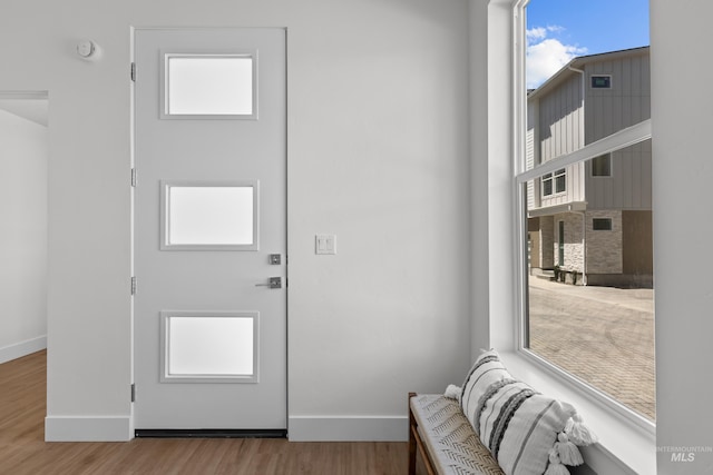509 E Violets Cove Ln, Garden City, ID 83714 - doorway to outside featuring wood finished floors and baseboards