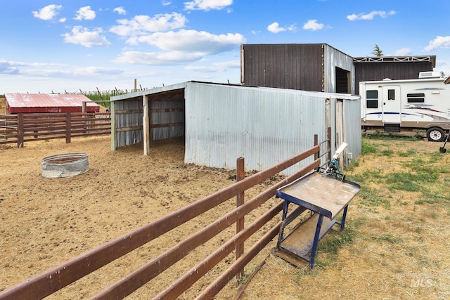 view of pole building featuring fence