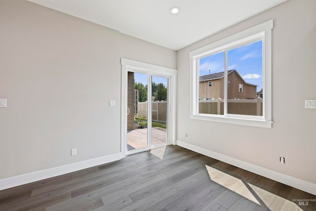 spare room featuring hardwood / wood-style flooring