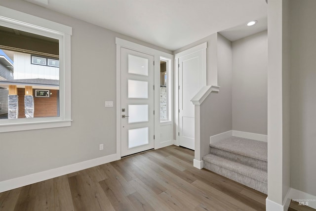 foyer entrance with light hardwood / wood-style floors