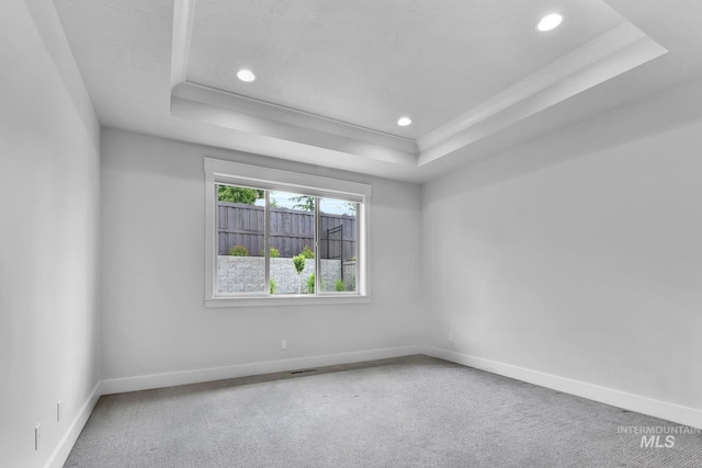 2499 E Berghan Ln, Meridian, ID 83642 - carpeted empty room with a raised ceiling, baseboards, and recessed lighting