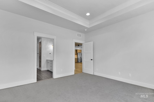 2499 E Berghan Ln, Meridian, ID 83642 - unfurnished bedroom with stainless steel refrigerator with ice dispenser, carpet, baseboards, recessed lighting, and a tray ceiling