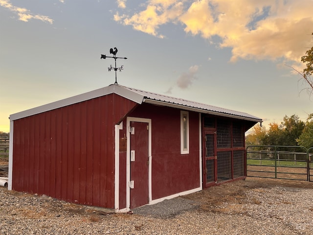 outdoor structure at dusk with an exterior structure and an outbuilding