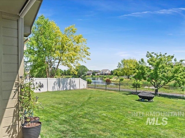 5747 W Rotherham Dr, Eagle, ID 83616 - fenced backyard with a water view