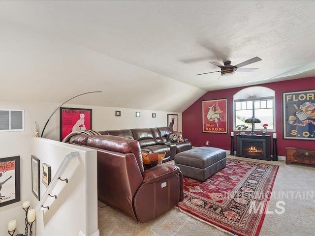 5747 W Rotherham Dr, Eagle, ID 83616 - home theater featuring light carpet, a ceiling fan, lofted ceiling, and a fireplace