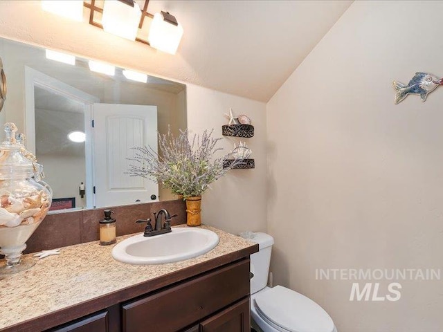 5747 W Rotherham Dr, Eagle, ID 83616 - bathroom featuring vanity and vaulted ceiling