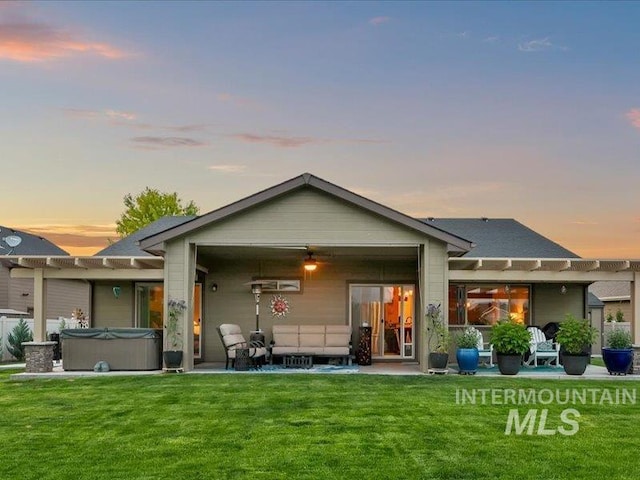 5747 W Rotherham Dr, Eagle, ID 83616 - rear view of property with a hot tub, a pergola, and a patio area