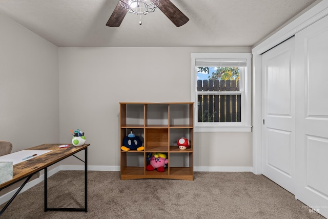 office featuring carpet floors and ceiling fan