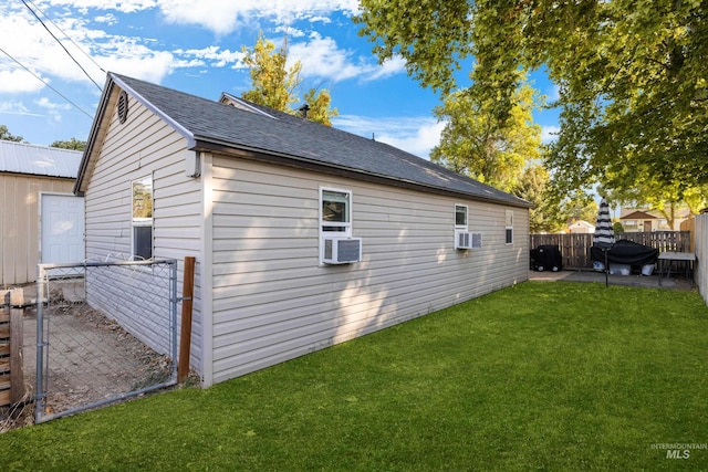 view of property exterior featuring cooling unit, a yard, and a patio area