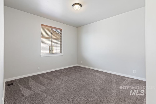 unfurnished room featuring carpet floors