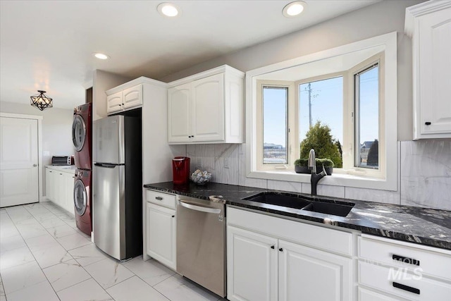 kitchen with recessed lighting, a sink, white cabinets, appliances with stainless steel finishes, and marble finish floor