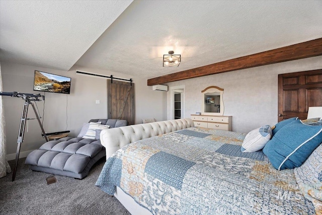 carpeted bedroom featuring beam ceiling, an AC wall unit, a textured ceiling, and a barn door