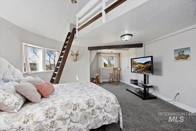 bedroom featuring baseboards, carpet floors, and a textured ceiling