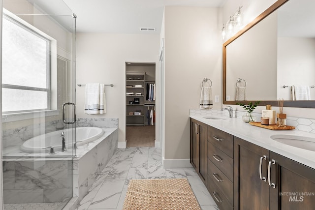 full bathroom featuring a sink, visible vents, marble finish floor, and double vanity