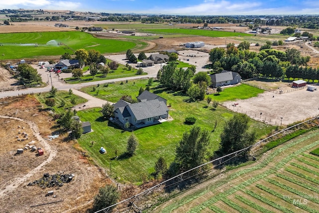 birds eye view of property with a rural view