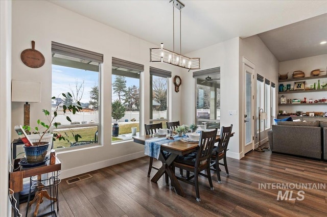 dining space featuring dark hardwood / wood-style floors