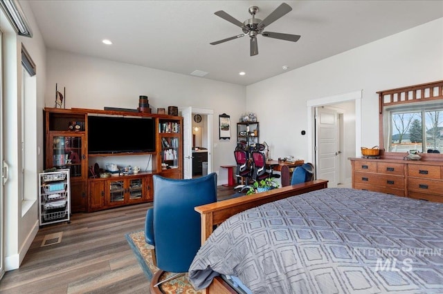 bedroom featuring ceiling fan and dark hardwood / wood-style flooring