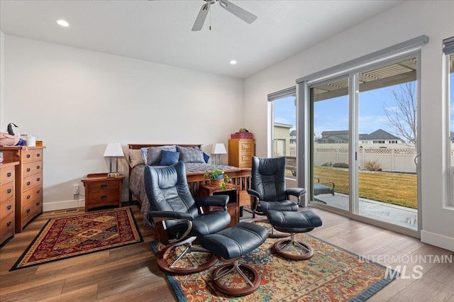 bedroom featuring wood-type flooring, access to exterior, and ceiling fan