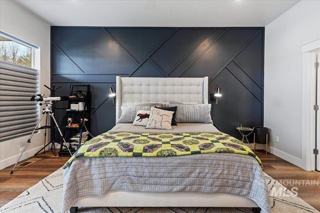 bedroom with hardwood / wood-style floors