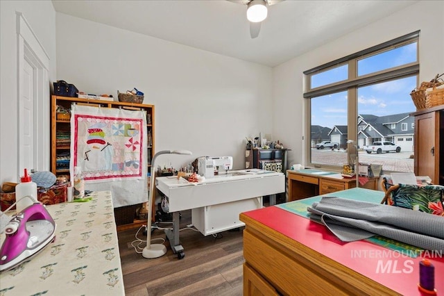 interior space featuring ceiling fan and dark hardwood / wood-style floors