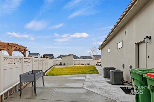 view of patio with cooling unit and a pergola