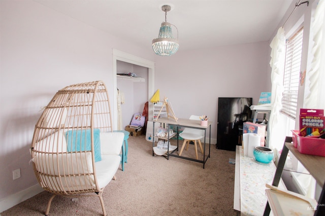 playroom with carpet flooring, a chandelier, and baseboards