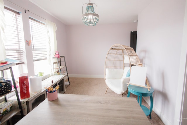 living area with carpet floors and baseboards