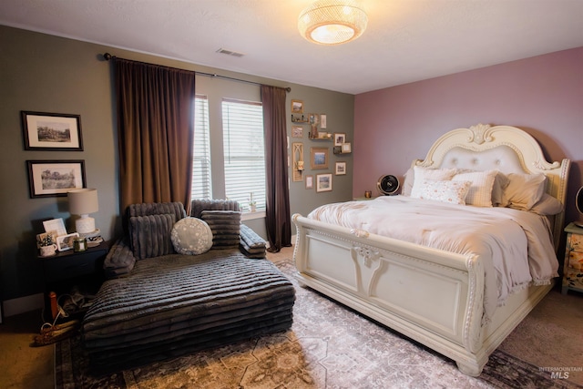 bedroom with light colored carpet