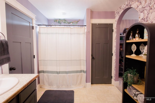 bathroom with vanity and curtained shower