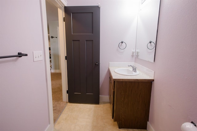 bathroom featuring vanity and baseboards