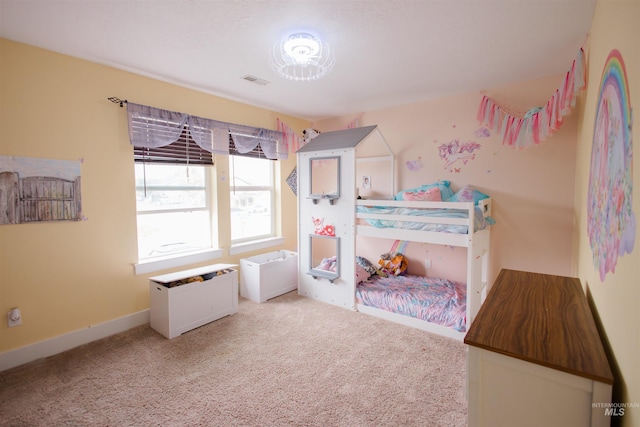 carpeted bedroom featuring baseboards