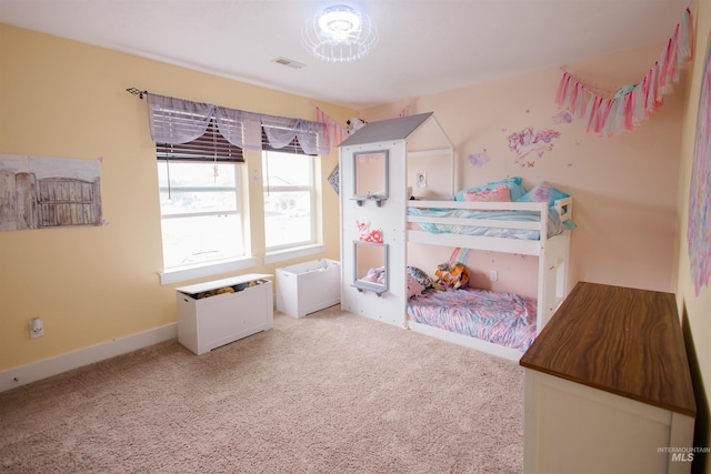 bedroom with carpet and baseboards