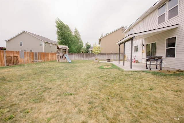 view of yard with a playground and a patio