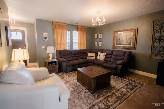 living room featuring a chandelier, healthy amount of natural light, and baseboards